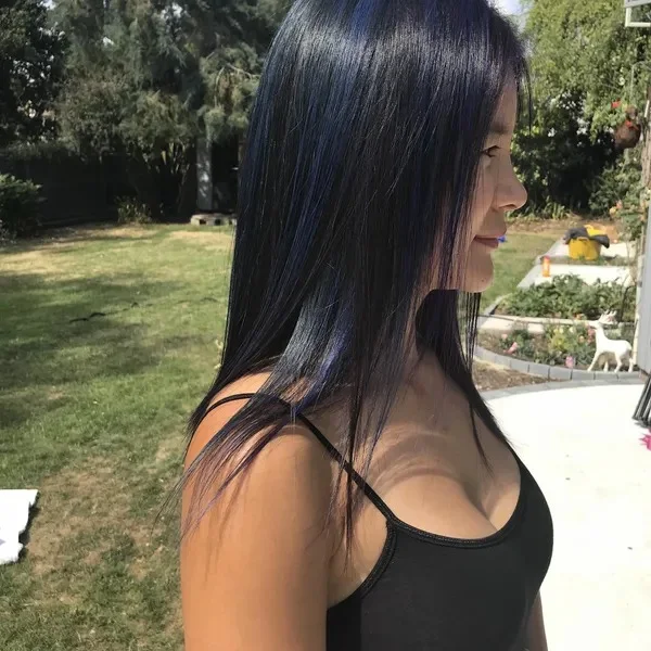 Blue-black hair with a blue tint, outdoors
